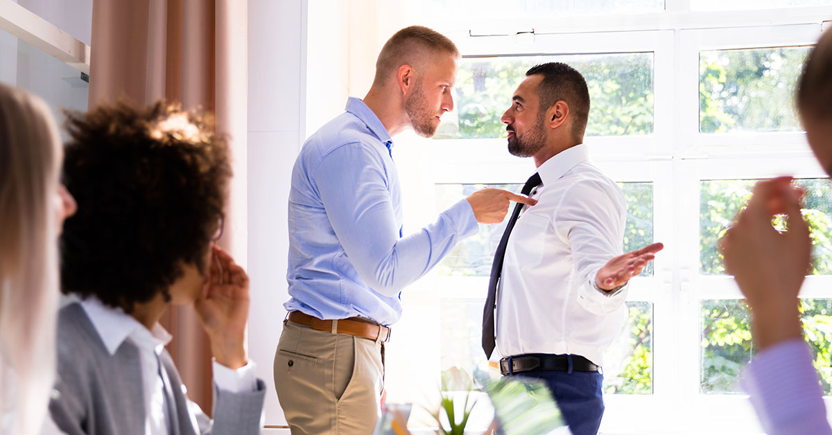 Two Male Colleagues Fighting In Office